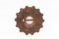 Copper brooch with punched patterns