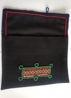 Lucet cord decorations on a woollen folder